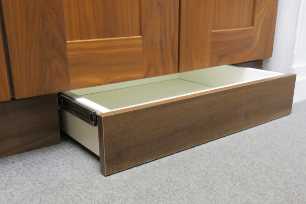 Skirting drawers to utilize space beneath dead